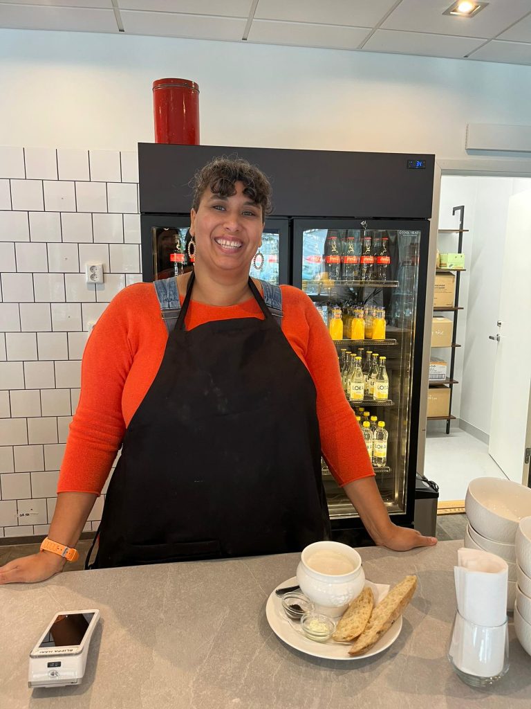 Waitress in cafe with a bowl of soup